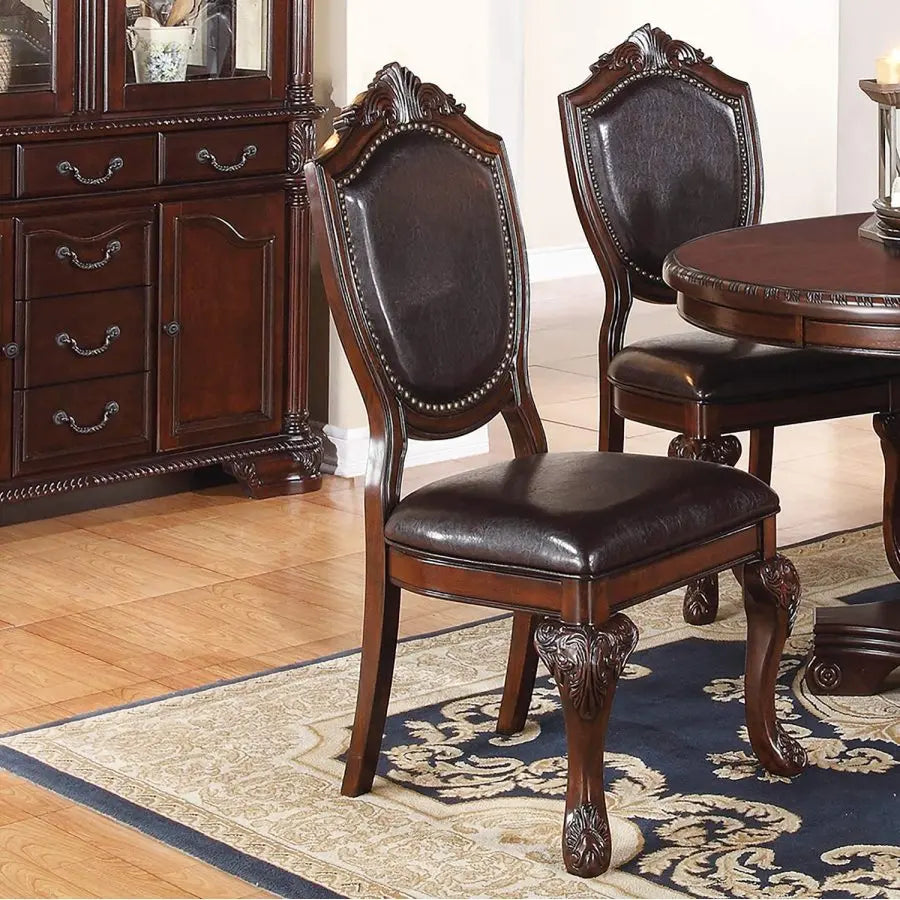 Five Piece Antique Dining Set With Round Table And Cushioned Chairs